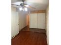 Bedroom with a ceiling fan and double door closet with access to other parts of the home at 4206 Clarinda St, Orlando, FL 32811