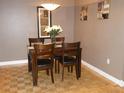 Dining room with wood table, chairs, and overhead lighting at 4340 Lakeway Dr # H, Orlando, FL 32839