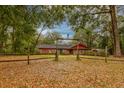 Quaint brick home with a wooden fence and yard, showcasing the property's curb appeal at 7252 June Bug Ln, Orlando, FL 32818