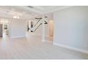 Bright living room featuring an open layout, coffered ceilings, and light hardwood floors at 11464 Beau Repost Dr, Orlando, FL 32832