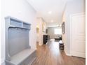 Inviting foyer with a built-in bench and coat rack, leading to an open living area at 12191 Sumter Dr, Orlando, FL 32824