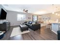 Comfortable living room with a large sectional sofa and an open concept design at 12191 Sumter Dr, Orlando, FL 32824