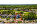 A beautiful property in a golf community featuring well-manicured lawns and mature trees at 1714 Golfview Dr, Kissimmee, FL 34746