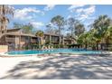 Large community pool offering plenty of space to swim, relax, and socialize with residents at 4828 Pebble Beach Dr # A, Orlando, FL 32811
