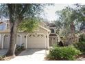 Charming home featuring a multi-car garage and a beautifully landscaped front yard with mature trees at 559 Northbridge Dr, Altamonte Springs, FL 32714