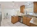 Bright kitchen features tile floors, granite countertops, and stainless steel appliances at 633 London Rd, Winter Park, FL 32792