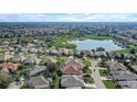 Beautiful aerial view of a community near a golf course and lake at 7233 Se 171St Pond Ln, The Villages, FL 32162