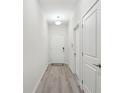 Bright hallway with wood-look floors leads to the main living area at 9819 Red Eagle Dr, Orlando, FL 32825