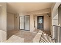 Covered porch with tiled flooring, leading to the main entrance with glass accents at 1055 Kensington Park Dr # 503, Altamonte Springs, FL 32714