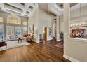 Spacious living room featuring wood floors, high ceilings, and stylish furnishings at 1554 Eagle Nest Cir, Winter Springs, FL 32708