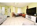 Bright living room with tile flooring, neutral paint, and ample natural light at 643 Captiva Cir, Kissimmee, FL 34741