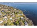 Aerial view showcasing the homes in a waterfront community on a sunny day at 9400 Ne 307Th Ct, Fort Mc Coy, FL 32134