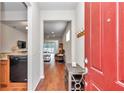 Inviting foyer with hardwood floors, a coat rack, and an open view into the living spaces at 9472 Sw 76Th St, Ocala, FL 34481