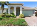 Charming single-story home with well-maintained lawn and tropical landscaping at 1714 Leatherback Ln, St Cloud, FL 34771