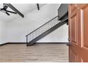 Inviting living room with sleek staircase, modern flooring, and bright, open space at 2447 Ne 7Th St, Ocala, FL 34470