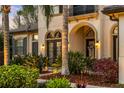 Inviting front entrance showcasing lush landscaping and elegant architectural details at 3123 Bentonshire Pl, Longwood, FL 32779