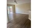 Bright living area featuring modern floors, a sliding glass door to the lanai, and a cozy breakfast bar at 3224 Holland Dr, Orlando, FL 32825