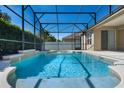 Sparkling screened-in pool with an attached spa and a spacious patio area at 713 Duff Dr, Winter Garden, FL 34787