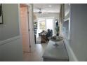 Bright living room with modern finishes, a ceiling fan, and sliding glass door access at 919 N Hastings St, Orlando, FL 32808