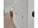 Hallway view with bright natural light and view into living room at 17019 Seville Orange Rd, Winter Garden, FL 34787