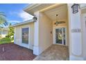 Inviting front entrance features brick pavers, overhead lighting, and detailed architectural accents at 1010 High Vista Dr, Davenport, FL 33837