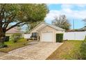 Inviting single-story home featuring a well-kept lawn and an attached one car garage at 15848 Autumn Glen Ave, Clermont, FL 34714