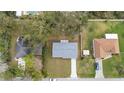 Aerial view of a home featuring a new roof, driveway, a small backyard, and neighboring houses at 1625 Victory Palm Dr, Edgewater, FL 32132