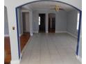 Open-concept living room features archways and tile flooring at 204 S Center St, Eustis, FL 32726