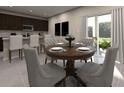 Inviting dining room with elegant table setting, modern chairs, and sliding glass doors to patio at 2311 White Tail St, Davenport, FL 33837