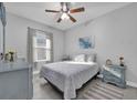 Bedroom with a large window and a ceiling fan provides a comfortable retreat at 281 Edisto Pl, Apopka, FL 32712