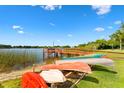 Waterfront community dock with canoe storage and lake access at 4312 Lake Underhill Rd # 19, Orlando, FL 32803