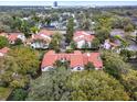 Community aerial view showcasing red tile roofs surrounded by lush green trees with city views at 520 Via Verona Lane # 103, Altamonte Springs, FL 32714