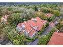 Aerial view of the homes with red roofs surrounded by lush greenery and trees at 520 Via Verona Lane # 103, Altamonte Springs, FL 32714