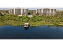 Aerial view of condos with dock and gazebo access to the serene lake at 6336 Buford St # 706, Orlando, FL 32835