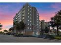 Stunning multi-story condo building with elegant architecture and sunset sky at 6336 Buford St # 706, Orlando, FL 32835