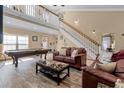 Inviting living room with a pool table, comfortable seating, and stylish decor at 113 Avalon Dr, Ormond Beach, FL 32176