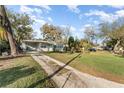 Quaint single-story home with covered parking and a well-maintained lawn at 1140 W Seminole Trl, Bartow, FL 33830