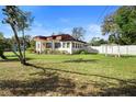 Spacious backyard with a well-manicured lawn at 1601 E 1St Ave, Mount Dora, FL 32757
