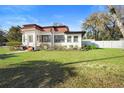 Beautiful home with a well-maintained lawn and a fenced backyard at 1601 E 1St Ave, Mount Dora, FL 32757
