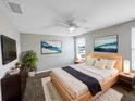 Comfortable bedroom with a cozy bed, soft rug, and a large window for ample natural light at 1613 Reflection Cv, St Cloud, FL 34771