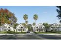 Street view of beautiful two-story homes with lush lawns and palm trees at 1987 Peel Ave, Orlando, FL 32806