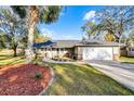 Charming single-story home with a manicured lawn and inviting front porch at 2469 Dartmouth Rd, Deland, FL 32724