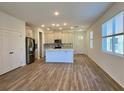 Spacious kitchen offering stainless steel appliances, a breakfast bar and lots of natural light at 2668 Spider Lily Ct, Clermont, FL 34711