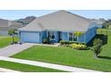 Charming single-story home with lush green lawn and neatly manicured landscaping at 4210 Sunset Preserve Blvd, Orlando, FL 32820