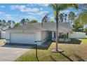 Charming single-story home featuring a 2-car garage and well-maintained landscaping at 100 Diamond Ridge Blvd, Auburndale, FL 33823