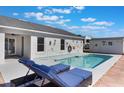 Relaxing pool area with lounge chairs and a patio, perfect for enjoying sunny days at 100 Diamond Ridge Blvd, Auburndale, FL 33823