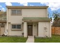 Charming two-story townhome features a well-maintained lawn and covered front entryway at 1269 Winter Green Way, Winter Garden, FL 34787