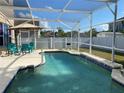 Inviting screened-in pool and patio area, perfect for relaxing and enjoying the outdoors at 14020 Sanibel Isle Dr, Orlando, FL 32824