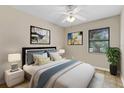 Cozy bedroom featuring calming colors, modern lamps and a serene ambiance for relaxation at 2643 Nova Dr, Apopka, FL 32703