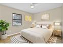 Inviting bedroom with a ceiling fan, neutral color scheme and natural light from the window at 2643 Nova Dr, Apopka, FL 32703